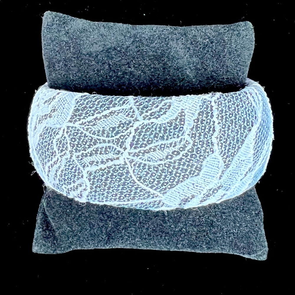 Black bangle covered in white lace